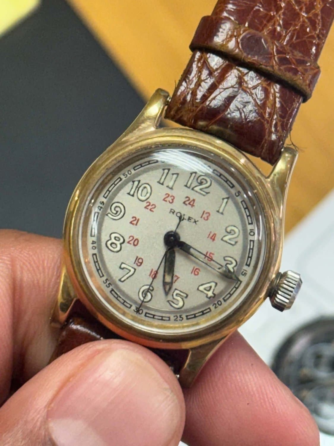 Rolex Skyrocket cream dial with black and red Arabic numerals, front view
