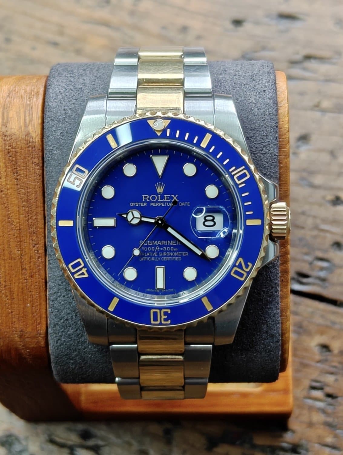 Rolex Submariner Date Bluesy 116613LB blue dial and blue bezel, front view on a stand