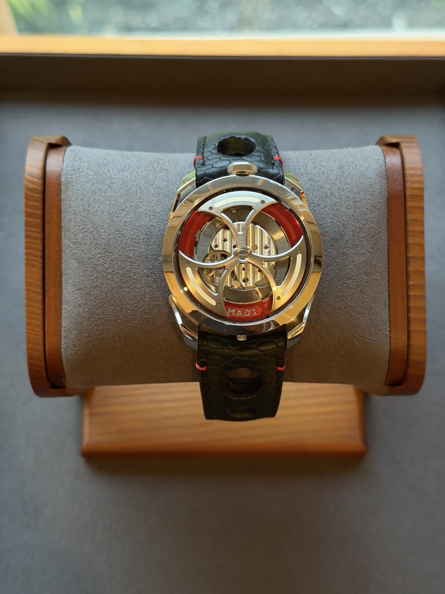 M.A.D. 1 displayed on a watch stand with the top-mounted rotor visible